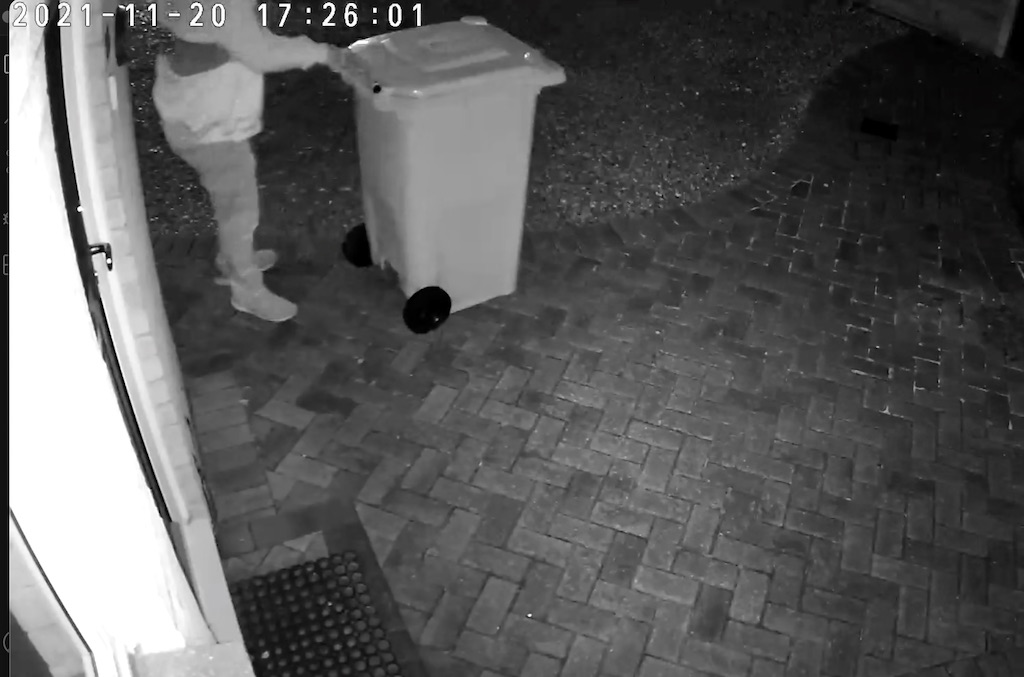 Neighbour moving the wheelie-bin